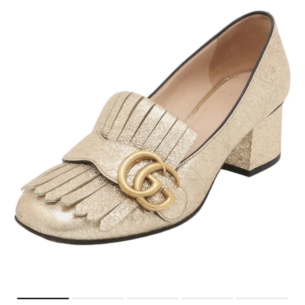 Gold Gucci loafers